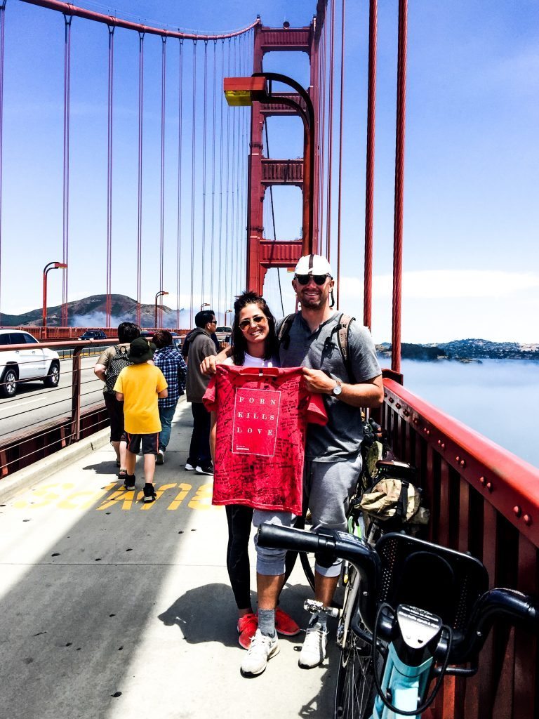 Garrett with his wife Ariel on the Golden Gate Bridge at the end of his journey.