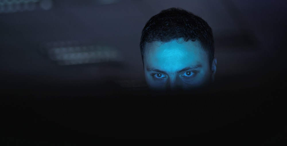 man-trafficker-eyes-dark-computer-glow-use-social-media-groom-control-victims-guy